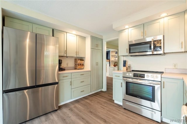278 Shady Grove Dr, Amherst, NY 14051 - kitchen with stainless steel appliances, light countertops, light wood-type flooring, and recessed lighting