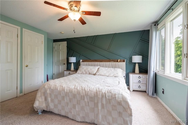 278 Shady Grove Dr, Amherst, NY 14051 - carpeted bedroom with multiple windows, a decorative wall, and ceiling fan