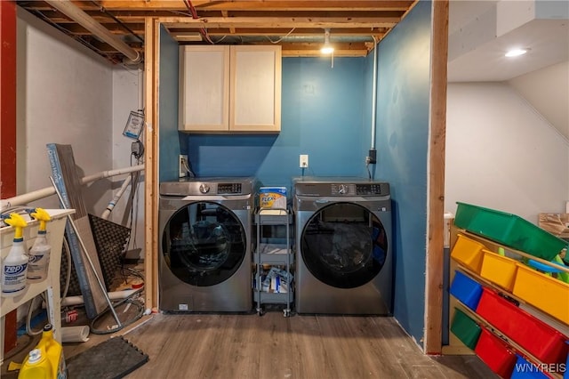 278 Shady Grove Dr, Amherst, NY 14051 - laundry area featuring separate washer and dryer, wood finished floors, and cabinet space