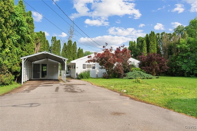 55 Ainslee Dr, Schroeppel, NY 13132 - view of front of property featuring a carport, asphalt driveway, and a front lawn