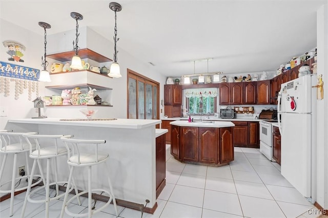 55 Ainslee Dr, Schroeppel, NY 13132 - kitchen with white appliances, light countertops, a peninsula, light tile patterned floors, and a kitchen bar