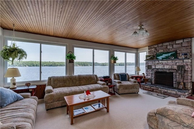 44420 Butterfield, Alexandria, NY 13607 - carpeted living area with wooden ceiling, a water view, and a stone fireplace