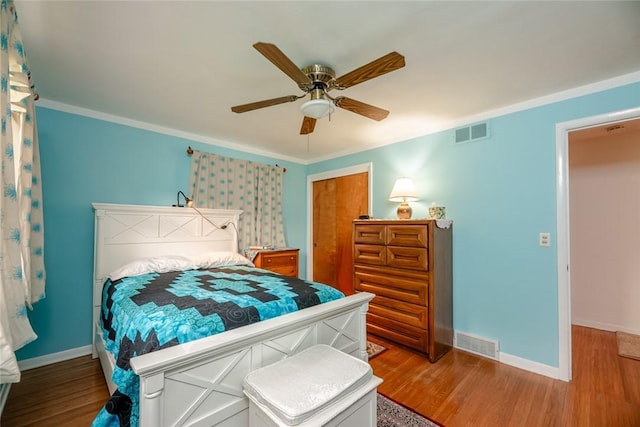 229 Angelus Dr, Irondequoit, NY 14622 - bedroom featuring wood finished floors, a closet, ceiling fan, and crown molding