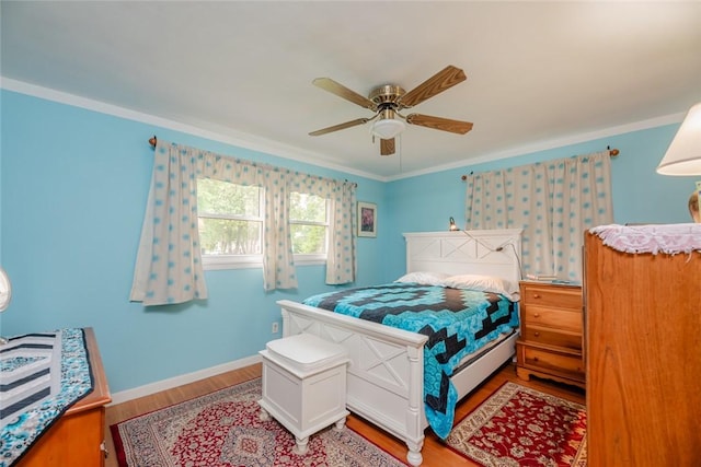 229 Angelus Dr, Irondequoit, NY 14622 - bedroom with light wood-style flooring, ornamental molding, and a ceiling fan