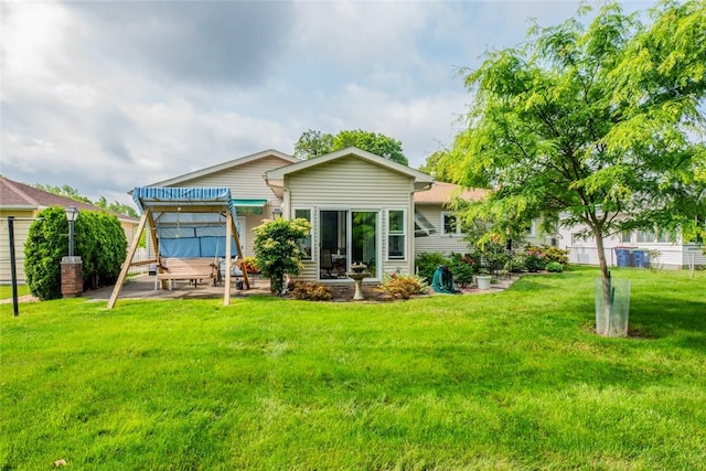 229 Angelus Dr, Irondequoit, NY 14622 - rear view of house with a patio area