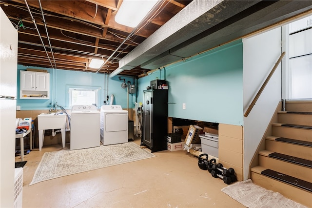 196 Saint Johns Dr, Greece, NY 14626 - basement featuring washing machine and dryer and stairs