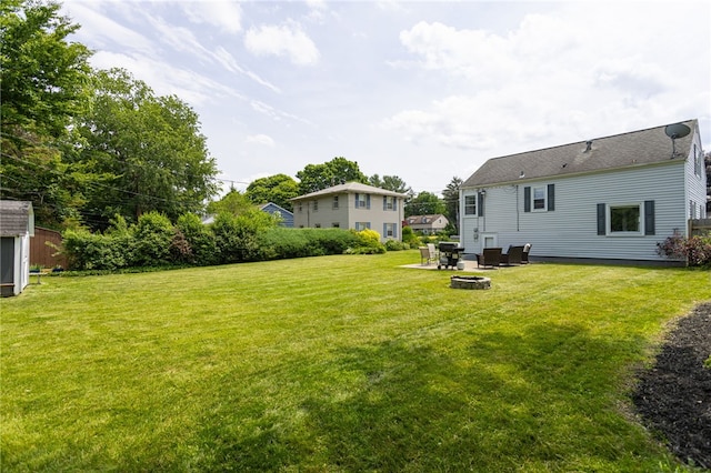 196 Saint Johns Dr, Greece, NY 14626 - view of grassy yard with an outdoor fire pit