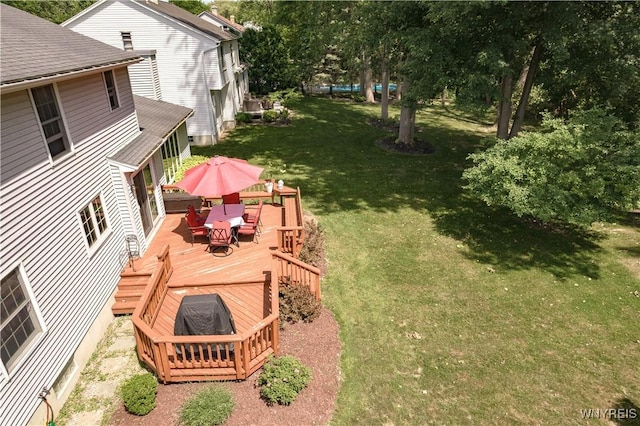 131 Daven Dr, Amherst, NY 14068 - view of grassy yard with a wooden deck, outdoor dining space, and a fire pit