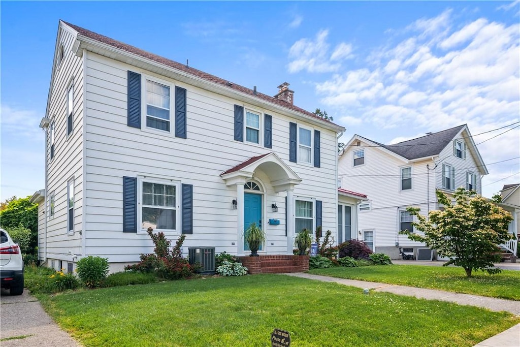 85 Maple St, Geneva City, NY 14456 - colonial house with a chimney and a front lawn