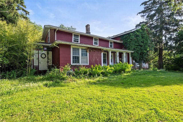 2429 English Rd, Greece, NY 14616 - view of front of home featuring a chimney and a front lawn