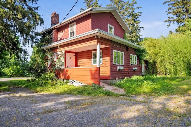 2429 English Rd, Greece, NY 14616 - view of front of property featuring a chimney and a porch