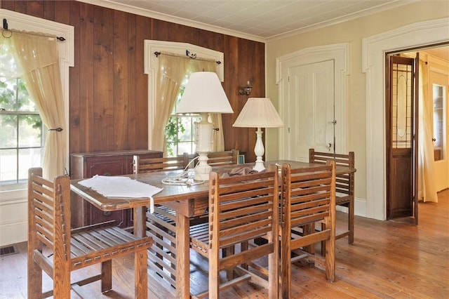 2429 English Rd, Greece, NY 14616 - dining room with crown molding, hardwood / wood-style floors, and wooden walls