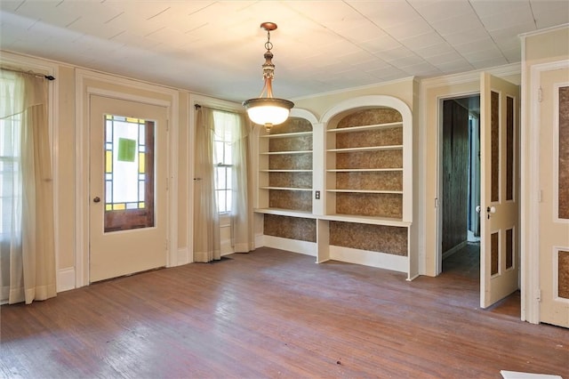 2429 English Rd, Greece, NY 14616 - unfurnished dining area featuring built in features, ornamental molding, and dark wood-style flooring