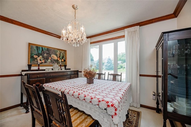 112 Pin Oak Ln, Irondequoit, NY 14622 - dining space featuring light carpet, a chandelier, and crown molding