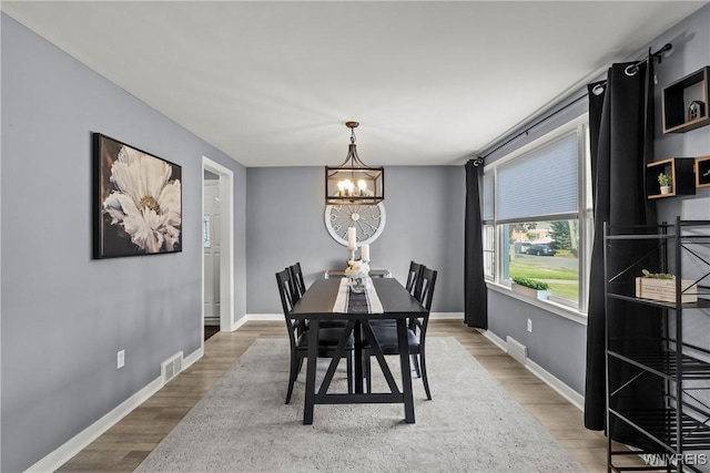 47 Waverly Ave, Tonawanda, NY 14217 - dining room featuring a chandelier and wood finished floors