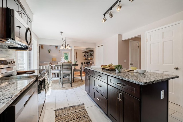 346 Willowood Dr, Greece, NY 14612 - kitchen featuring appliances with stainless steel finishes, pendant lighting, light stone countertops, and a chandelier