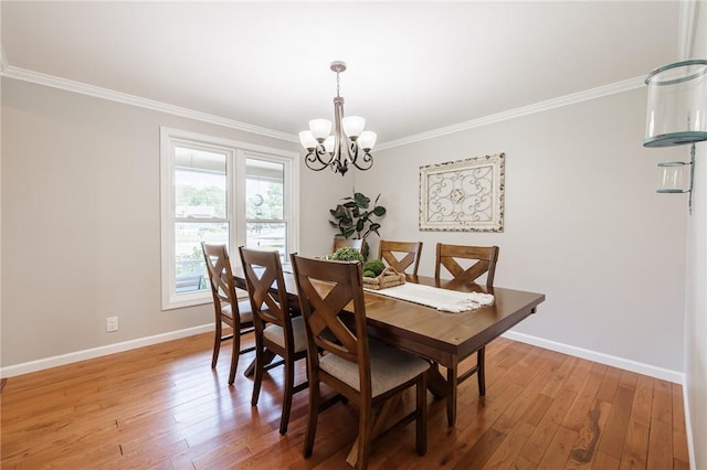 346 Willowood Dr, Greece, NY 14612 - dining room with a chandelier, ornamental molding, and light wood-style flooring