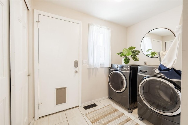 346 Willowood Dr, Greece, NY 14612 - laundry area featuring washer and dryer and light tile patterned floors