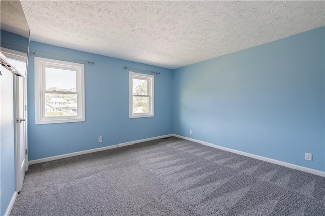 346 Willowood Dr, Greece, NY 14612 - carpeted spare room featuring a textured ceiling and baseboards