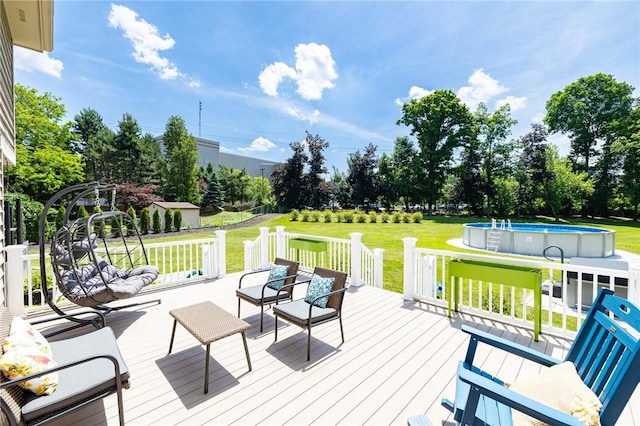 346 Willowood Dr, Greece, NY 14612 - wooden terrace with an outdoor pool, a lawn, and view of scattered trees