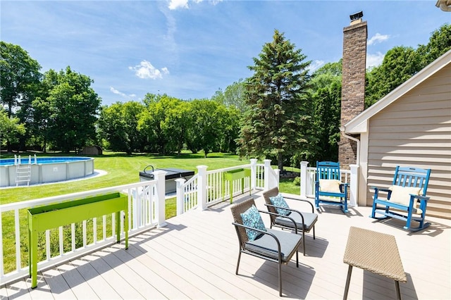 346 Willowood Dr, Greece, NY 14612 - wooden terrace with an outdoor pool, a lawn, and view of scattered trees