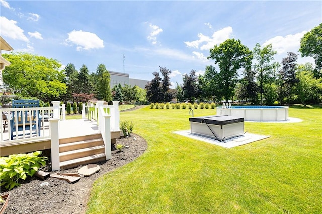 346 Willowood Dr, Greece, NY 14612 - view of green lawn featuring a wooden deck and an outdoor pool