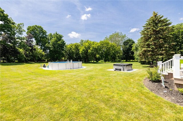 346 Willowood Dr, Greece, NY 14612 - view of grassy yard with view of scattered trees and an outdoor pool