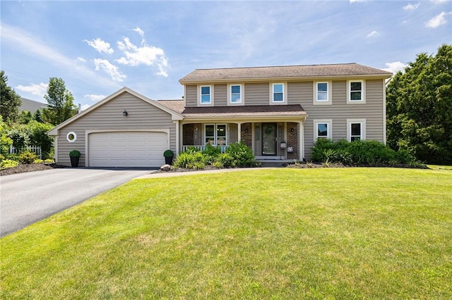 346 Willowood Dr, Greece, NY 14612 - view of front facade featuring covered porch, driveway, an attached garage, and a front yard