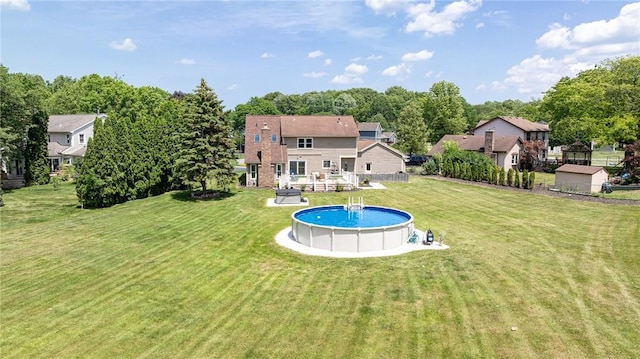 346 Willowood Dr, Greece, NY 14612 - rear view of house with a yard and an outdoor pool