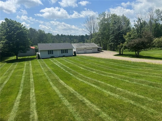 504 Whites Hill Rd, Guilford, NY 13780 - rear view of house featuring dirt driveway, a garage, and a yard
