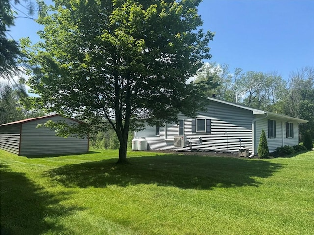 504 Whites Hill Rd, Guilford, NY 13780 - back of house featuring a lawn and an outdoor structure