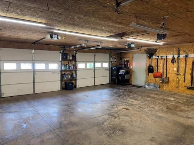 504 Whites Hill Rd, Guilford, NY 13780 - garage featuring a garage door opener
