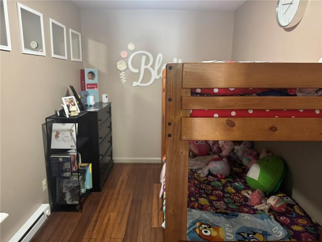 504 Whites Hill Rd, Guilford, NY 13780 - bedroom with a baseboard heating unit and wood finished floors