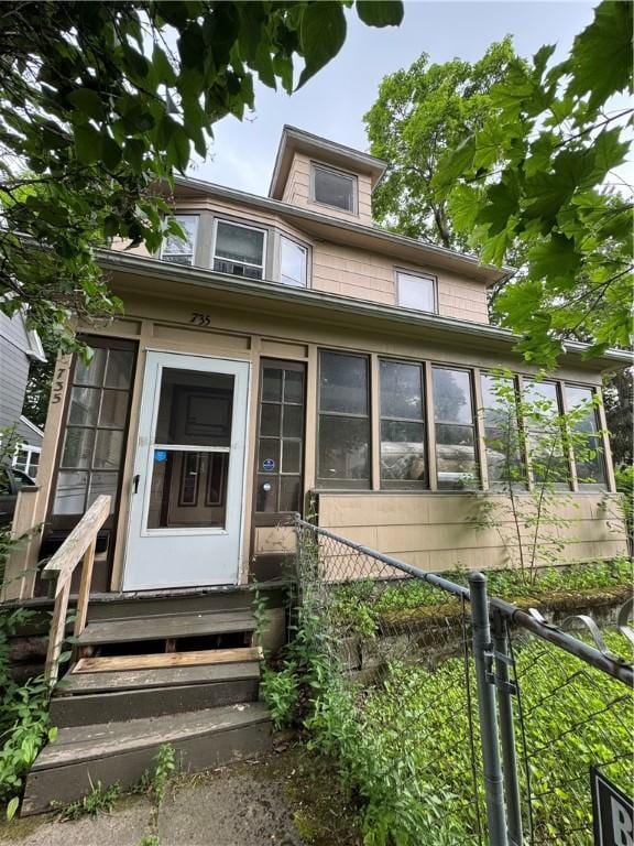 735 Garson Ave, Rochester, NY 14609 - view of front of house featuring entry steps and a sunroom