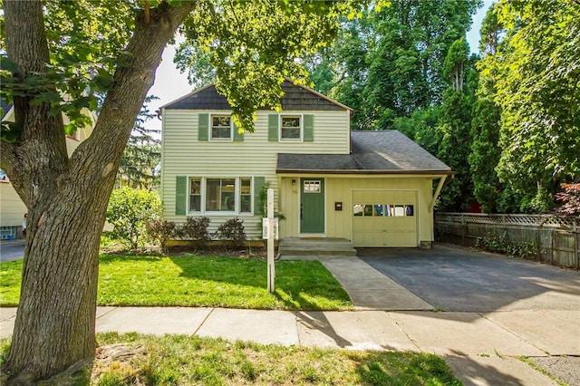 125 Amsterdam Rd, Rochester, NY 14610 - view of front of house with a garage, driveway, and board and batten siding