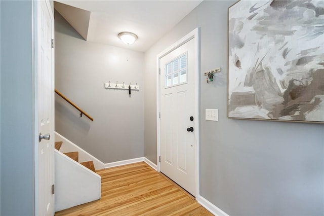 125 Amsterdam Rd, Rochester, NY 14610 - foyer entrance with light wood-style floors and stairs