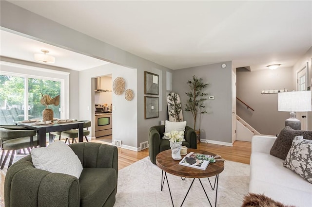 125 Amsterdam Rd, Rochester, NY 14610 - living area with stairs and light wood-type flooring