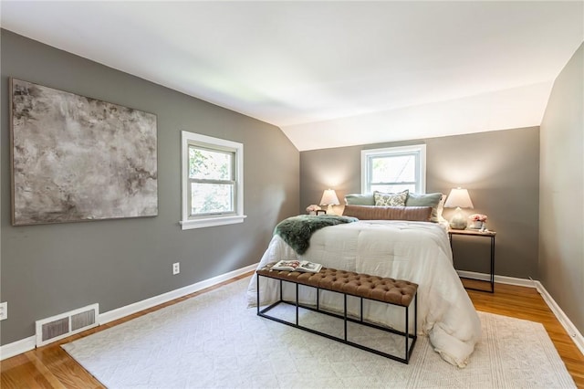 125 Amsterdam Rd, Rochester, NY 14610 - bedroom with lofted ceiling and wood finished floors
