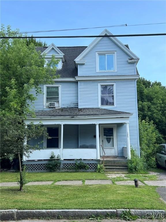 127 W Ostrander Ave, Syracuse, NY 13205 - view of front facade featuring a front lawn, a porch, and a shingled roof