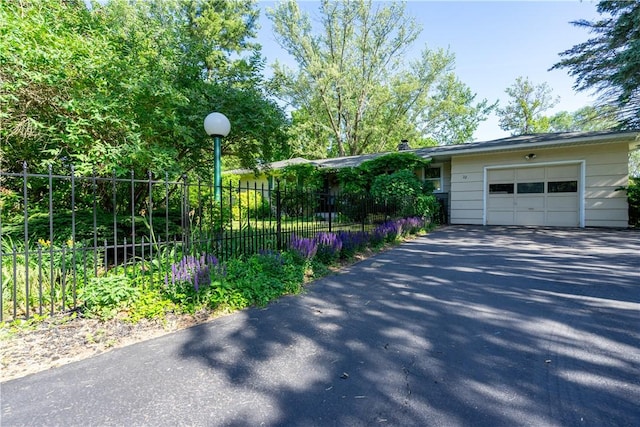 22 Virginia Ln, Chili, NY 14624 - view of front of house with driveway and a garage