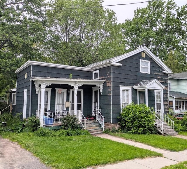 12 N Liberty St, Albion, NY 14411 - view of front facade with a porch and a front yard
