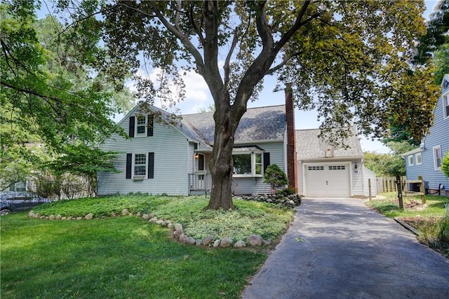 36 Oakmount Dr, Irondequoit, NY 14617 - traditional-style home featuring driveway, a front lawn, a garage, and a chimney