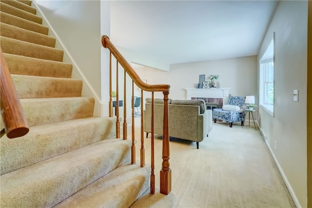 36 Oakmount Dr, Irondequoit, NY 14617 - staircase featuring carpet flooring and a brick fireplace