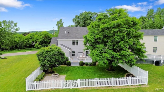 117 Shaker Hts, Camillus, NY 13031 - rear view of house featuring a fire pit, a wooden deck, and a fenced backyard