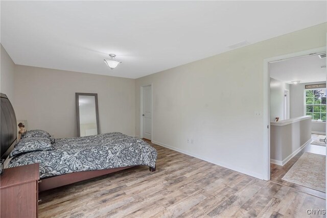 117 Shaker Hts, Camillus, NY 13031 - bedroom featuring wood finished floors and baseboards