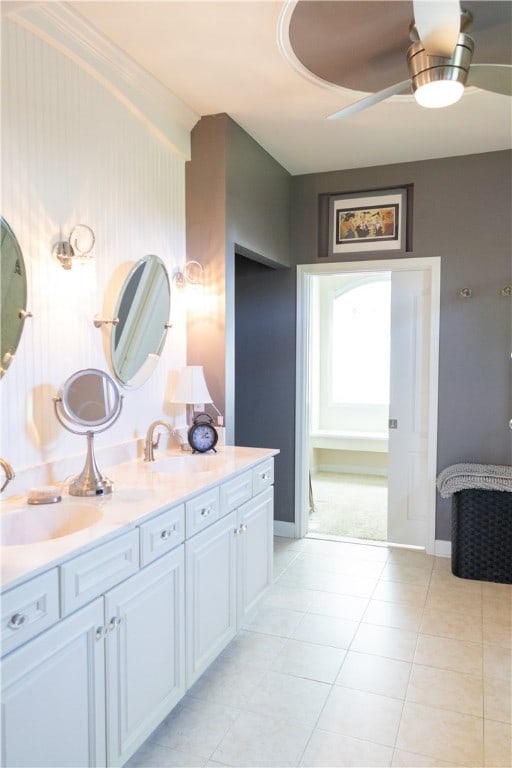84 Watersong, Penfield, NY 14580 - bathroom with double vanity, ceiling fan, and tile patterned flooring