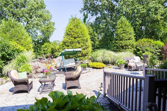 84 Watersong, Penfield, NY 14580 - view of patio featuring view of wooded area