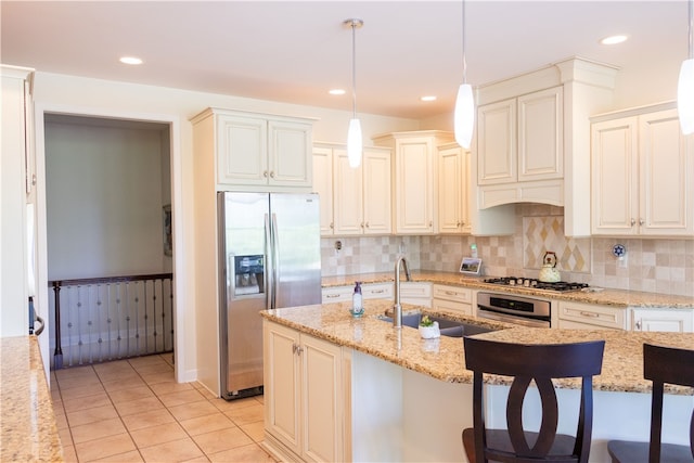 84 Watersong, Penfield, NY 14580 - kitchen with stainless steel appliances, light stone counters, decorative light fixtures, light tile patterned floors, and decorative backsplash