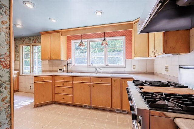500 Pine Grove Ave, Irondequoit, NY 14617 - kitchen with extractor fan, stove, wallpapered walls, healthy amount of natural light, and light countertops