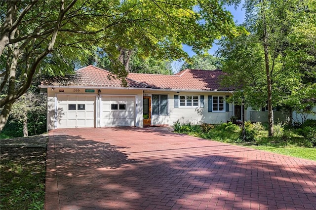 500 Pine Grove Ave, Irondequoit, NY 14617 - ranch-style home featuring a garage, decorative driveway, and a tile roof